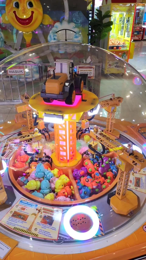 The toy excavator on display at the coin game Video stock 220904341