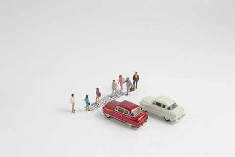 The toy figure cross the bar code Stock-Fotos