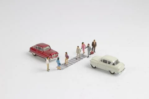 The toy figure cross the bar code Foto stock
