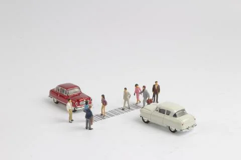 The toy figure cross the bar code Stock-Fotos