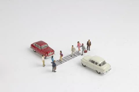 The toy figure cross the bar code Foto stock