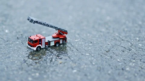 Toy Fire Engine in Water Stream - Graded Rec709 WDR Vídeo Stock 115758923