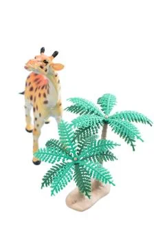 Toy Giraffe with Trees Stock Photos