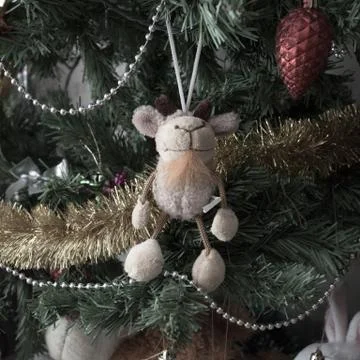 Toy goat on the tree Stock Photos