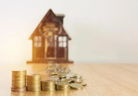 Toy house with money stack step growing money, Concept finance business and s Stock Photos