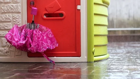 Toy house in the rain Stock Footage 82007270
