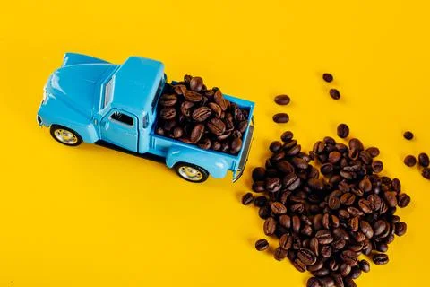 The toy machine is loaded with coffee beans. Delivery of coffee beans Stock Photos