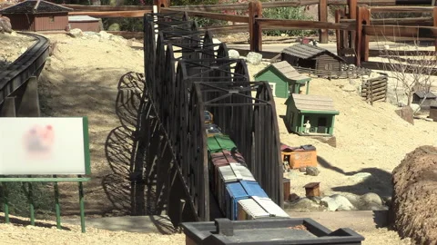 Toy model train over bridge Stock Footage 167144427