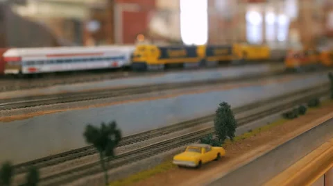 Toy model trains on display passing each other on a railroad set 動画素材 52551392