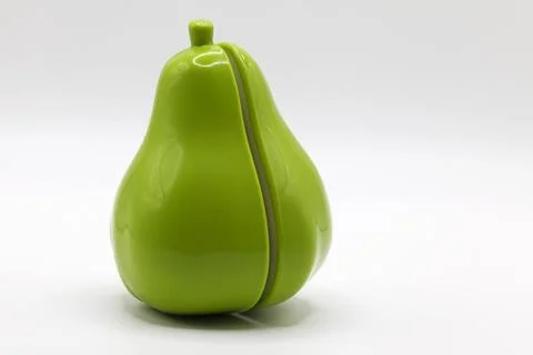 A toy pear that can be split in half Stock Photos
