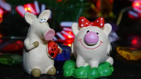 Toy pig and winter decor, congratulations on the holiday. Symbol of the year  Stock Photos