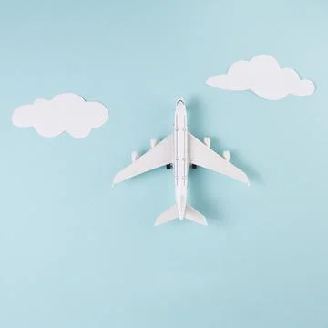 Toy plane clouds blue background. High quality and resolution beautiful photo Stock Photos