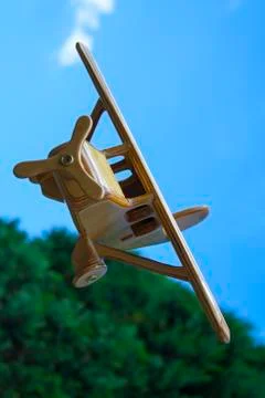 Toy plane flying over mountain Stock Photos