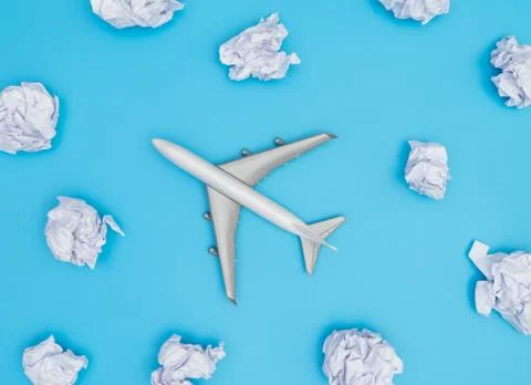 Toy plane flying in Papar cloud with blue background 库存照片