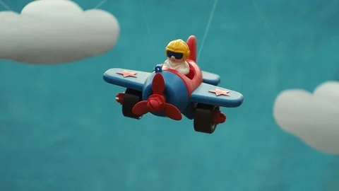 The toy plane with the pilot hangs on a grove. Stock Footage 102776066