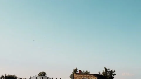 Toy planes controlled by remote control make a show in the sky Stock Footage 135973721