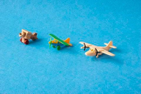 Toy planes retro on blue background. Set of vintage models of airplanes in Stock Photos