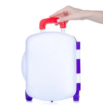 Toy plastic suitcase in hand Stock Photos