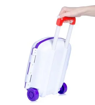 Toy plastic suitcase in hand Stock Photos