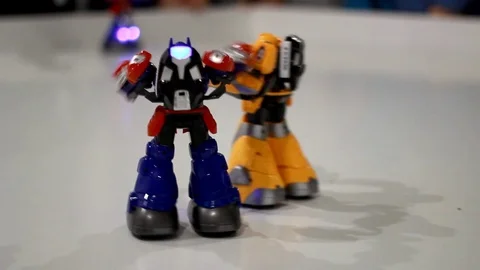 Toy robot transformer fighting. Closeup of transformer robot fighting Stock Footage 72793230