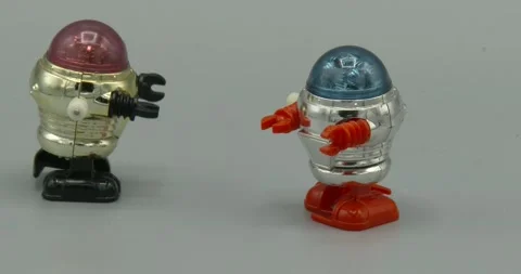Toy Robot Walking and Falling Over Stock Footage 164929999