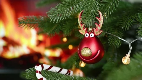 Toy in the shape of a red deer head against the background of a Christmas tree Stock-Footage 220131099