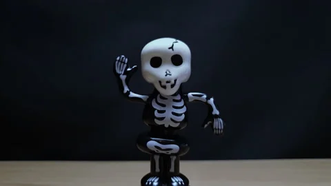 Toy skeleton dancing on black background 库存影片 151801643