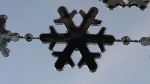 Toy snowflakes waving in the wind, a cold day. conveys an exciting mood. Stock Footage 82604627