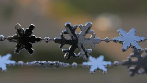 Toy snowflakes waving in the wind, a cold day. conveys an exciting mood. Stock Footage 82604859