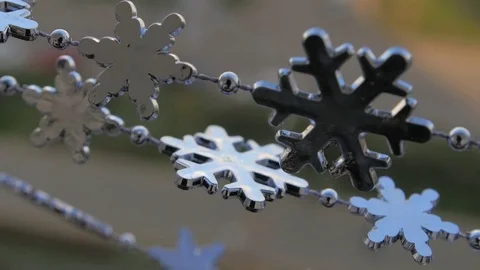 Toy snowflakes waving in the wind, a cold day. conveys an exciting mood. Stock Footage 82604982
