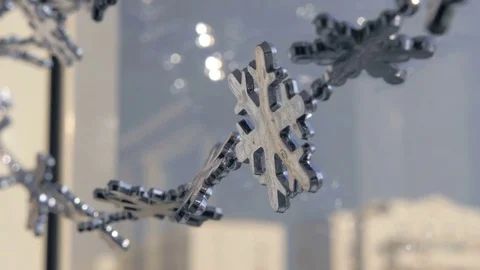 Toy snowflakes waving in the wind, a cold day. conveys an exciting mood. Stock Footage 82645122