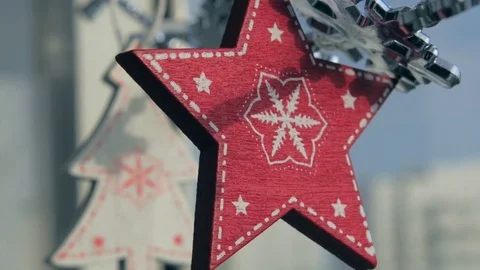 Toy snowflakes waving in the wind, a cold day. conveys an exciting mood. Stock Footage 82645366