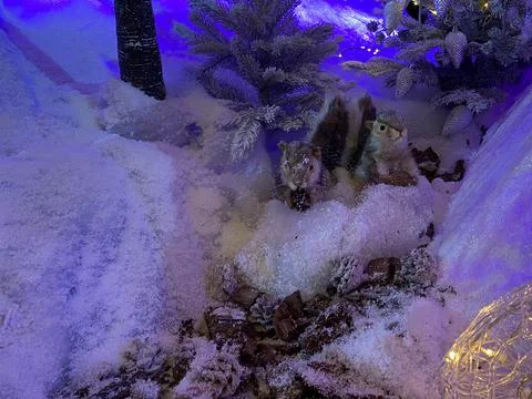 Toy squirrel or gopher sitting on a fluffy fir branches. Merry Christmas and  Stock Photos