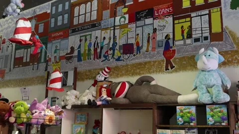 Toy store interior with Dr. Seuss mural and plush toys Stock Footage 336350187