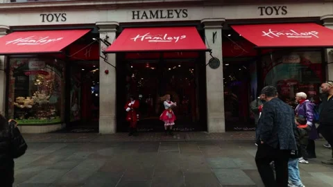 Toy Store Staff Dancing Outside Retail Entrance to Entertain Shoppers Stock Footage 336179124