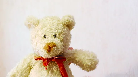 Toy teddy bear waving his paw Stock Footage 57308802