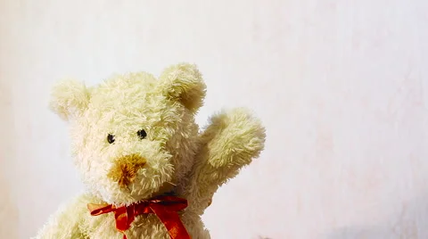 Toy teddy bear waving his paw Stock Footage 57308993