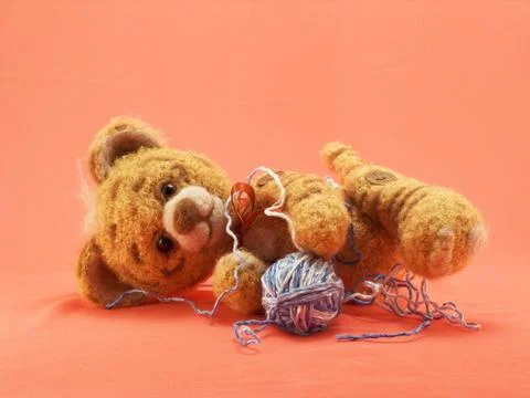 Toy tiger with a ball of threads Stock Photos