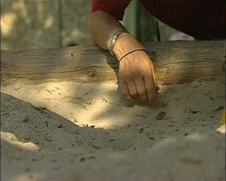 Toy tractor in a sandbox Stock-Footage 21332534