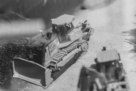 Toy tractor in the scenery of coal mining 库存照片