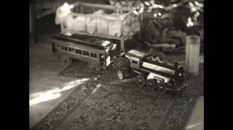 Toy Train in front of Christmas Tree Stock Footage 50215337
