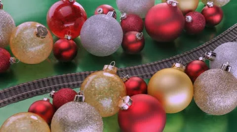 Toy train passes through Christmas tree decorations Video stock 12361774
