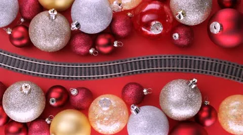 Toy train passing through Christmas tree decorations Video stock 12363817