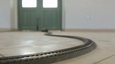 Toy train riding from out of focus Stock Footage 37558032