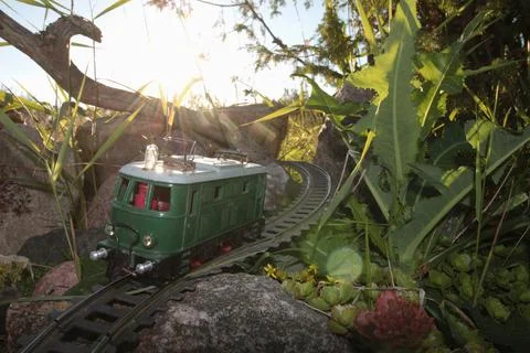 Toy train at sunset Stock Photos