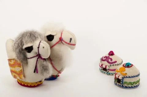 Toy two small camel and two eastern houses isolated on the white background. Stock Photos