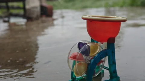Toy water mill in the rain Stock Footage 63208103