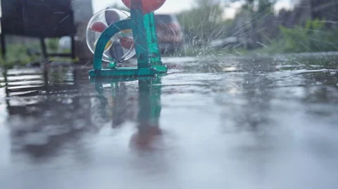 Toy water mill in the rain 動画素材 63208376
