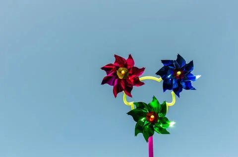 Toy windmill made of multi-colored paper Stock Photos