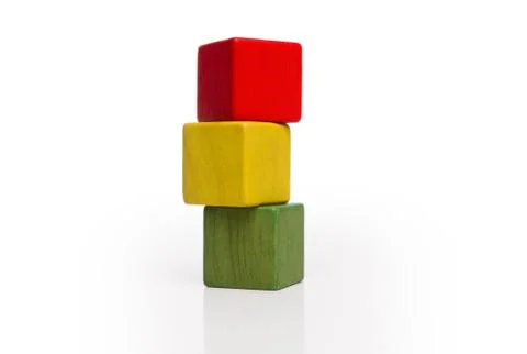 Toy wooden blocks stack, tower of blank multicolor box cube over white Stock Photos
